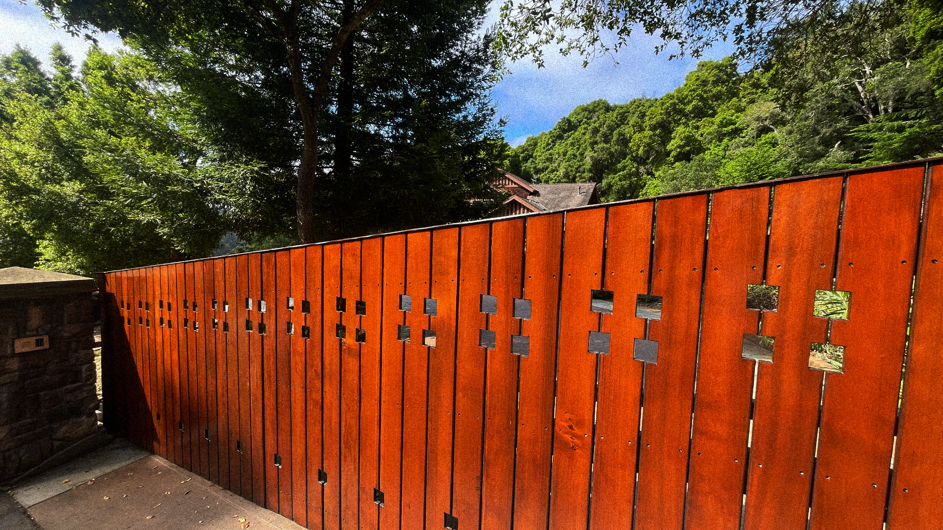 Wooden gate with metal accents